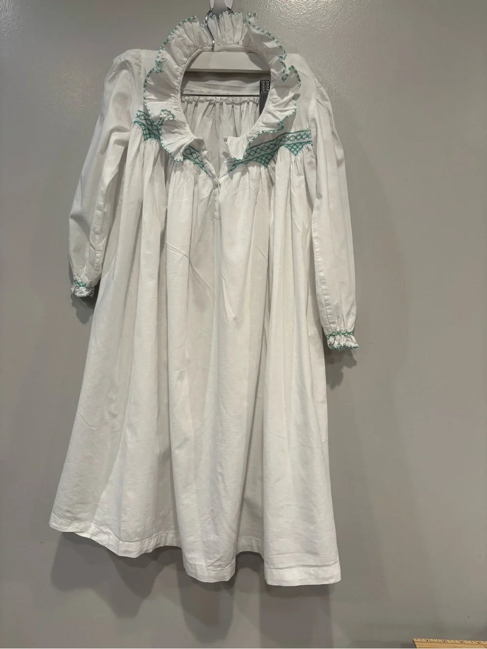 White Girls' Long Sleeve Dress with Mint Smocking Detail Hand Smocked.